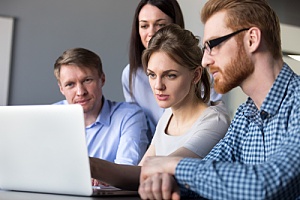 Business team analyzing computer